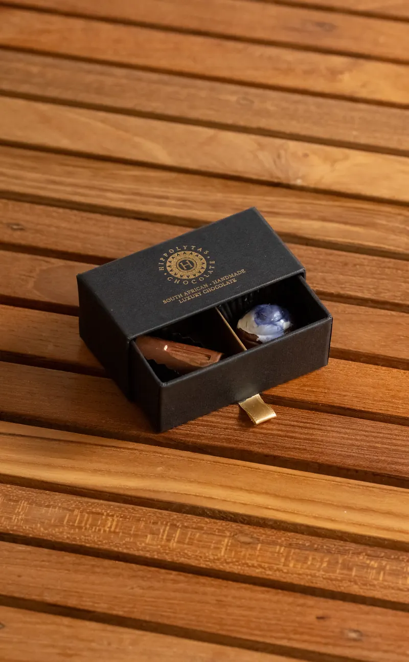Hippolytas Chocolate 2 piece gift drawer, open to show two handmade chocolates