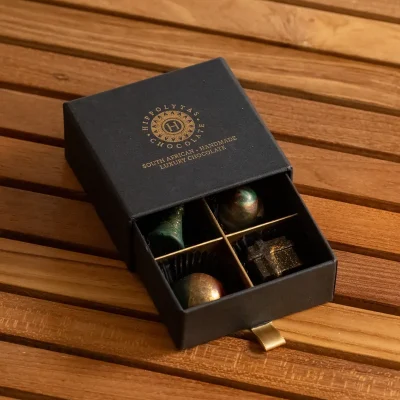 Hippolytas Chocolate 4 piece gift drawer, open to show four handmade chocolates